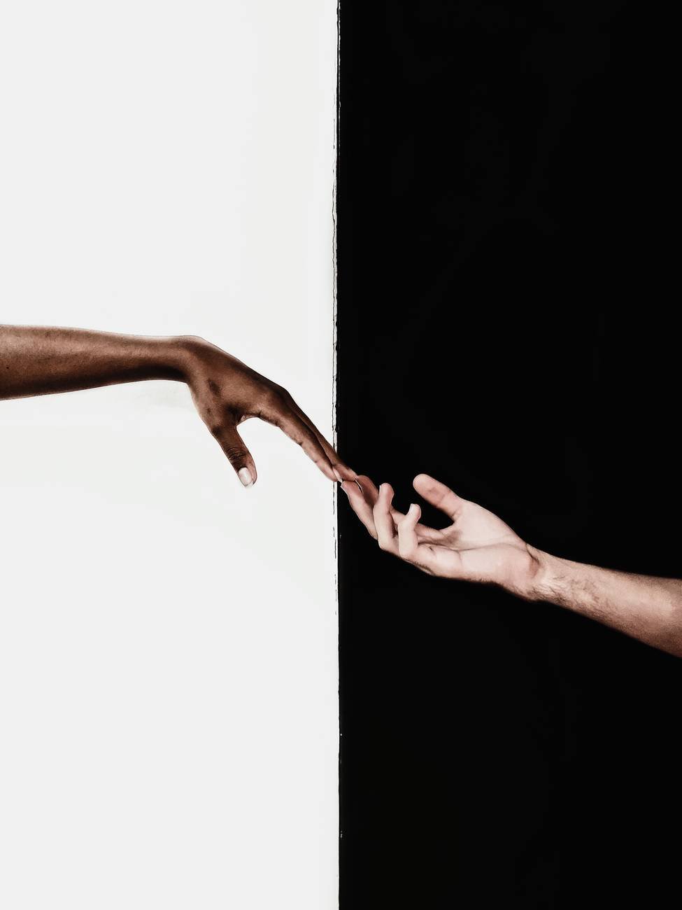 hands in front of white and black background